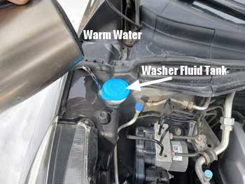 Melting frozen washer fluid